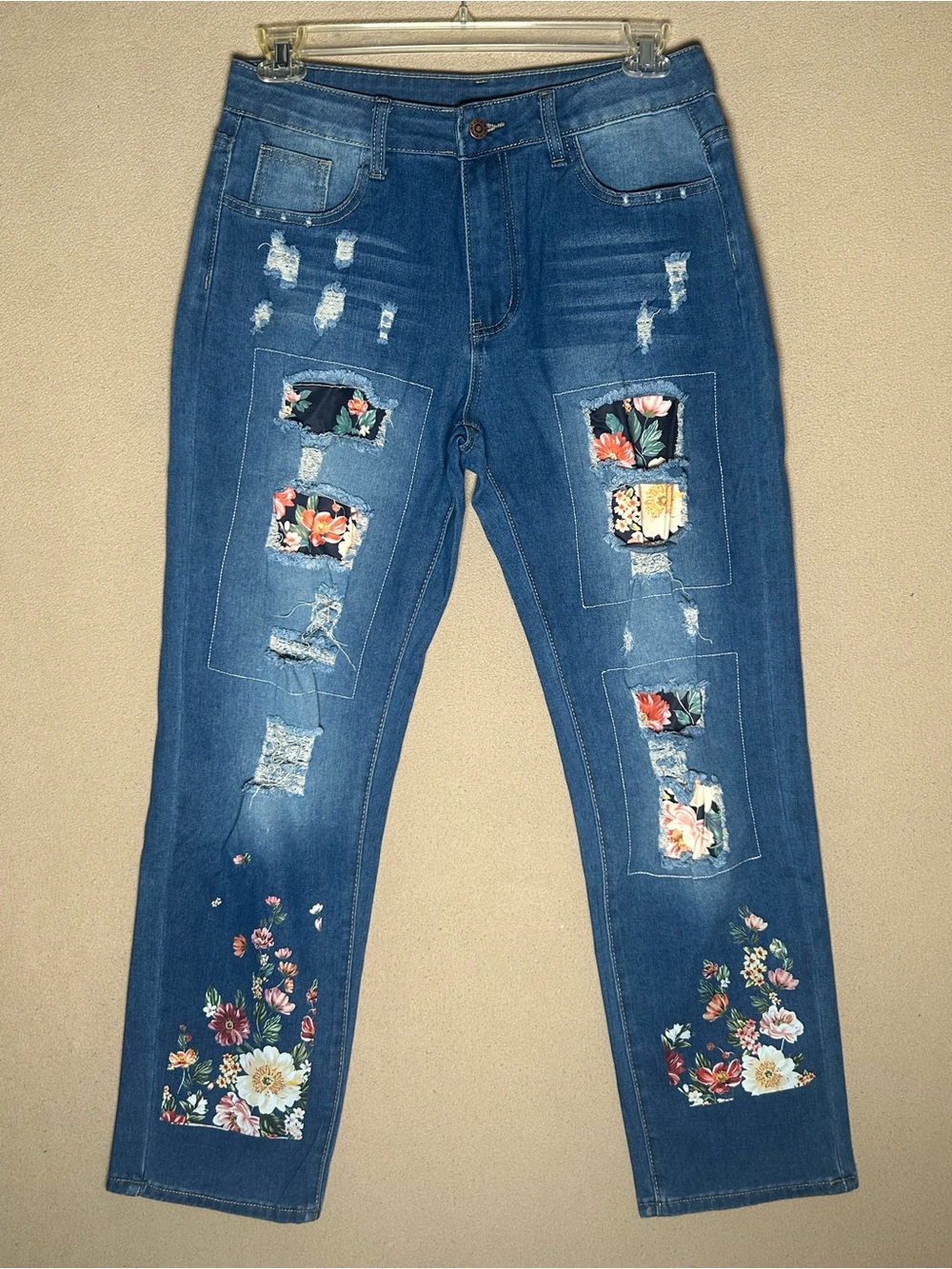 Distressed patched Blue denim boot cut Jeans with Floral Patches Size medium.